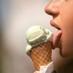 A girl licking ice cream